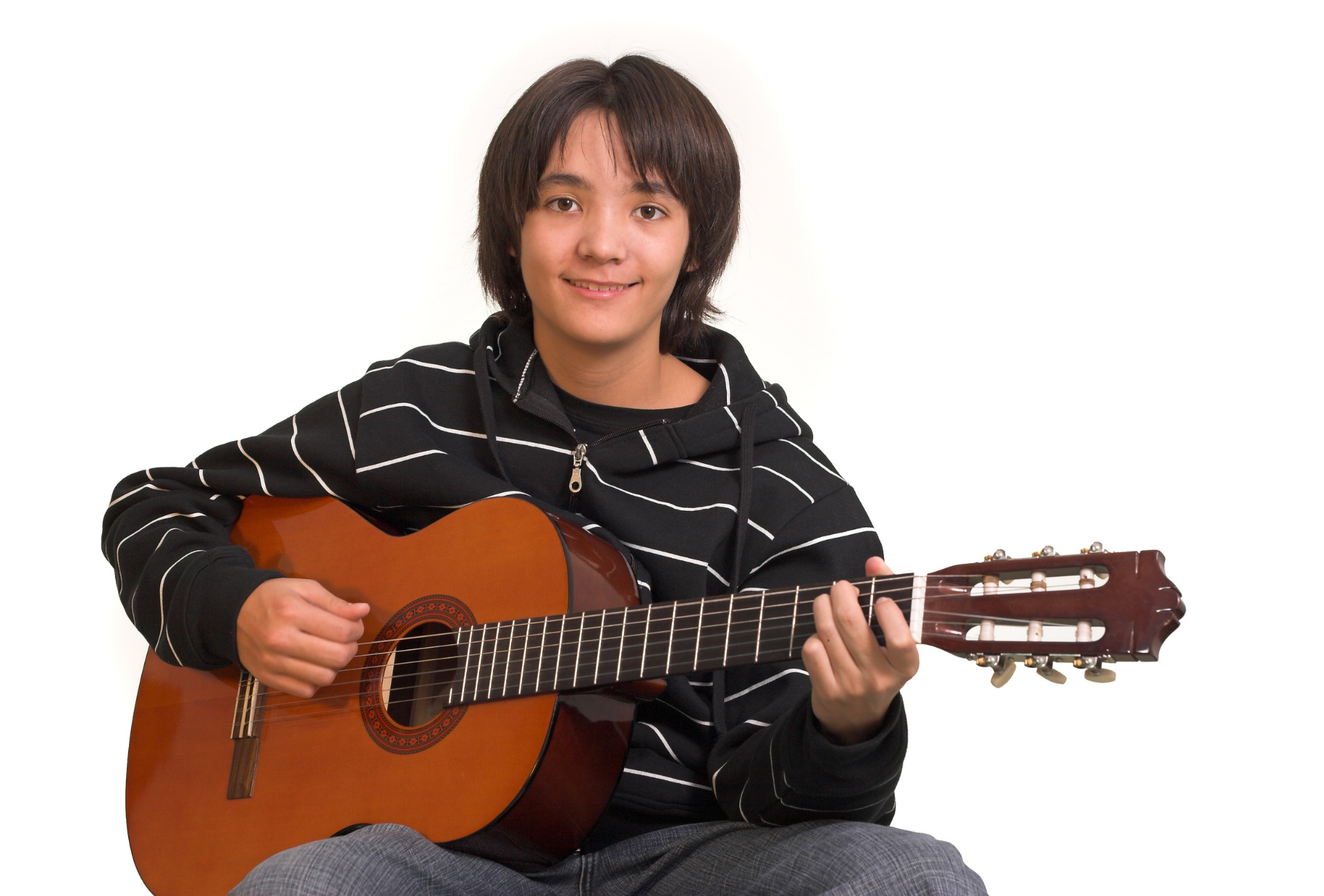 Smiling boy playing guitar